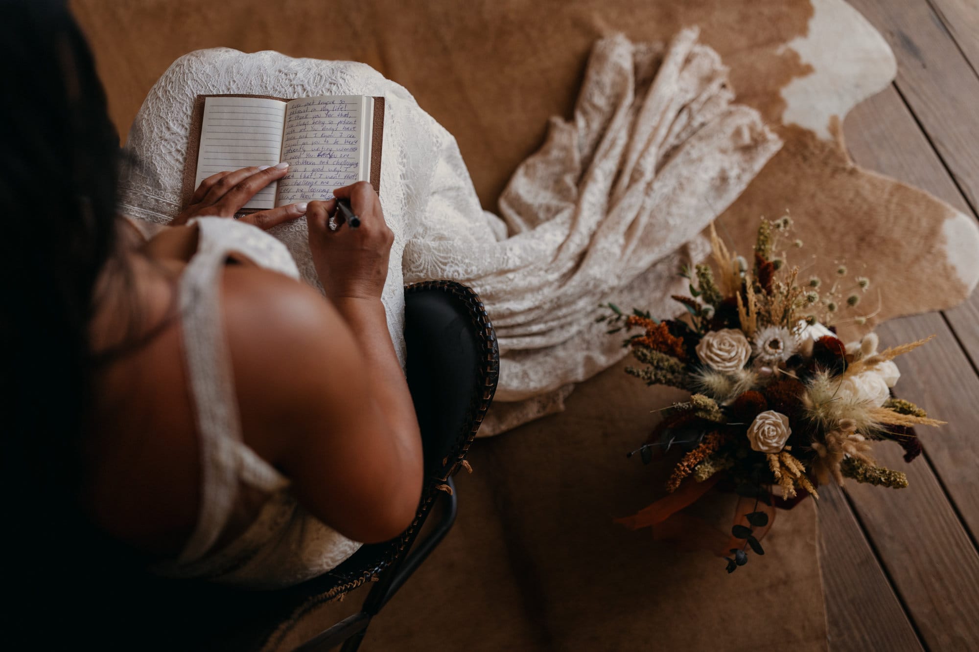 The bride writes her vows.