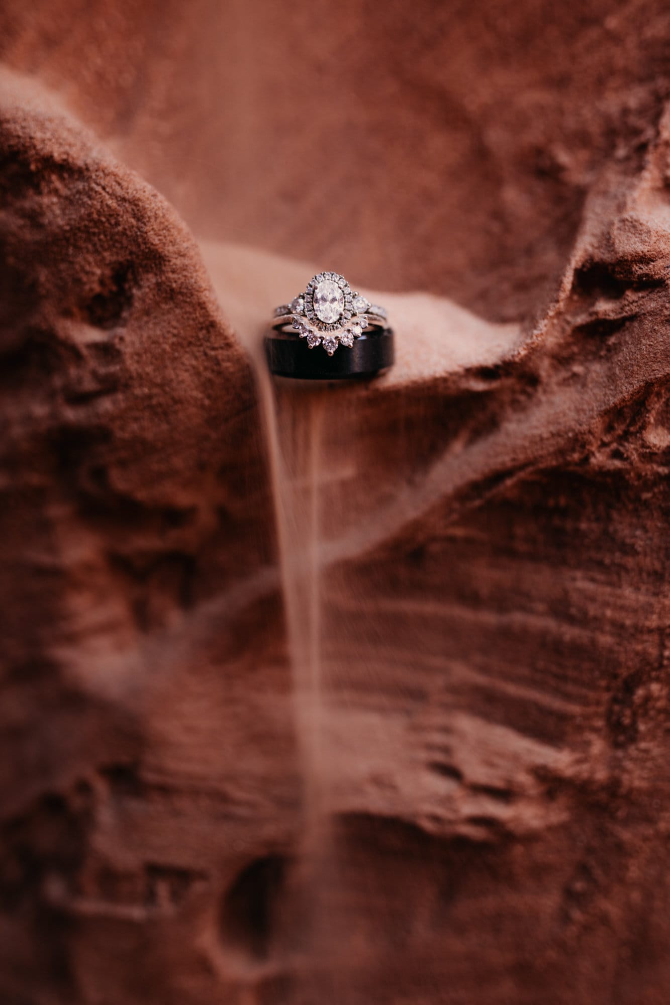 A detail photo of the rings with sand going through them.