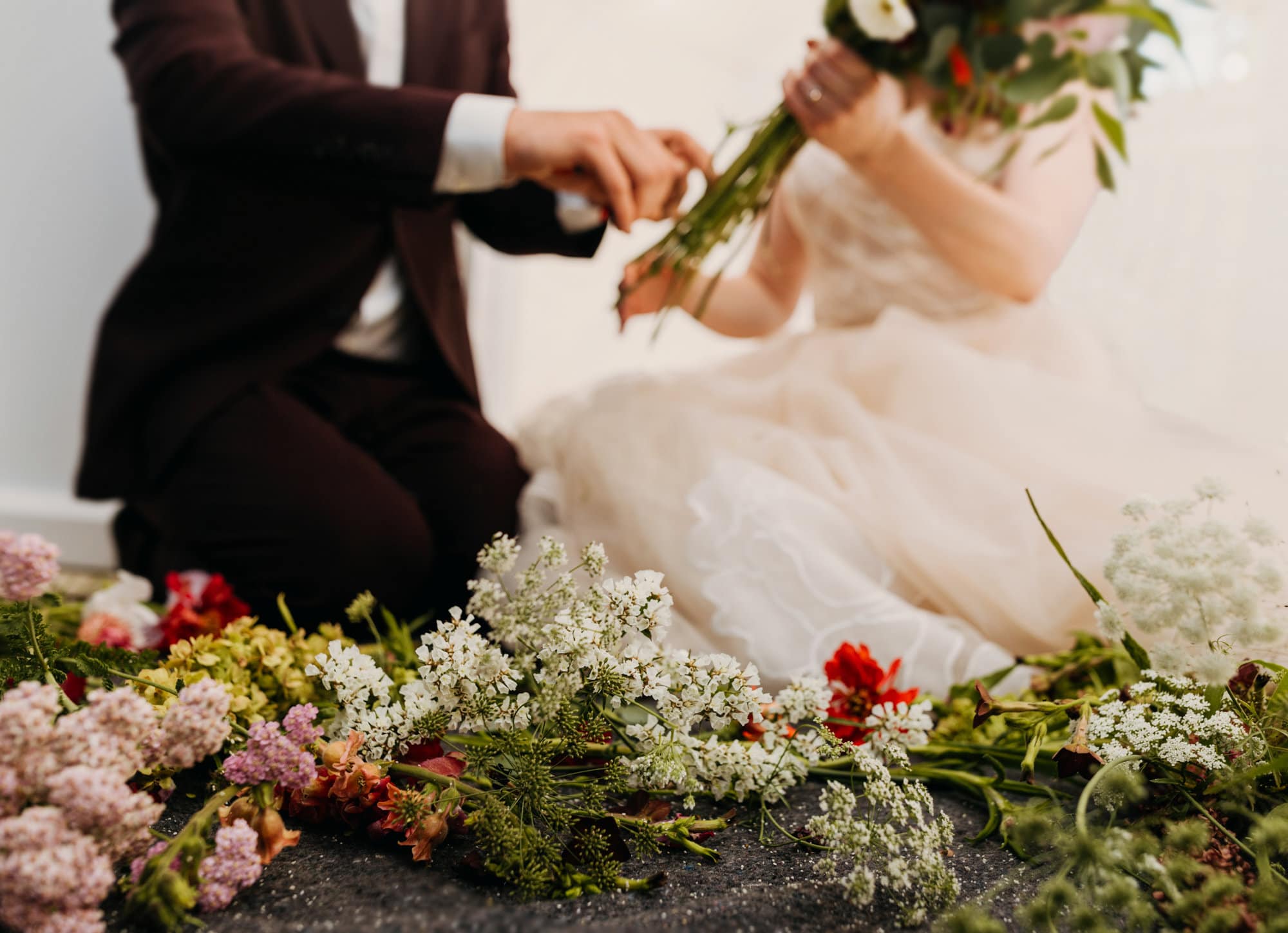 The bride and groom create their bouquet.