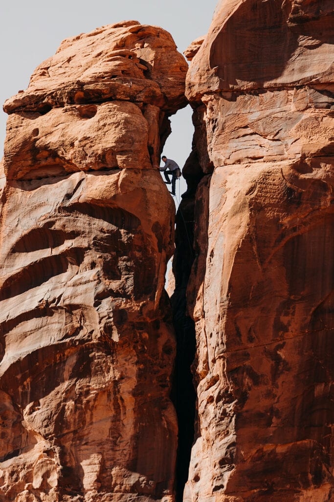 The groom in the crux of the climb.