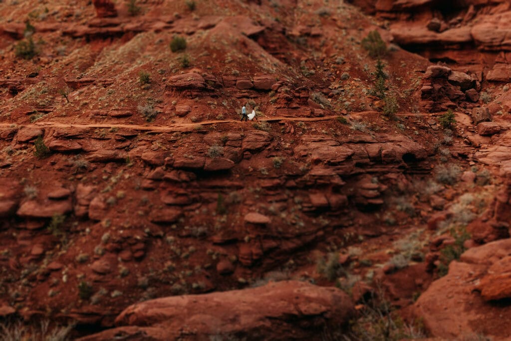 The couple hikes together at Fisher Towers.