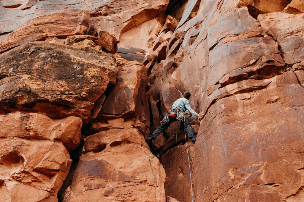 The groom starts to lead the climb.