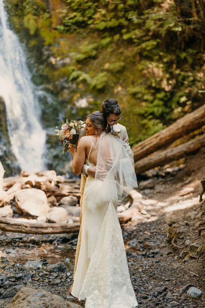 The bride and groom hug after their first look together.