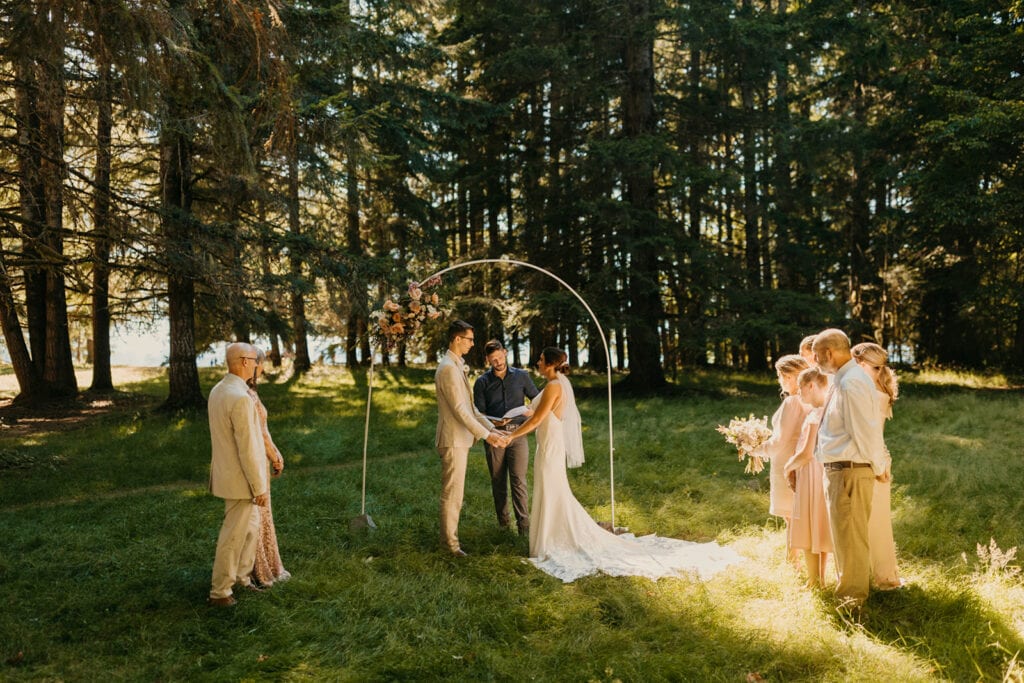 The family stands round the couple during their ceremony.