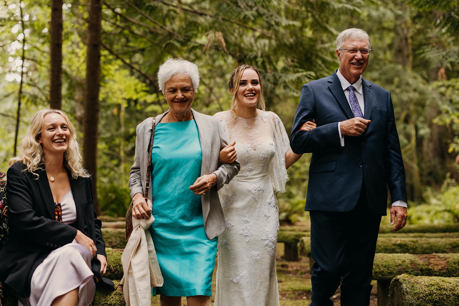 The brides parents walk her down the aisle. 