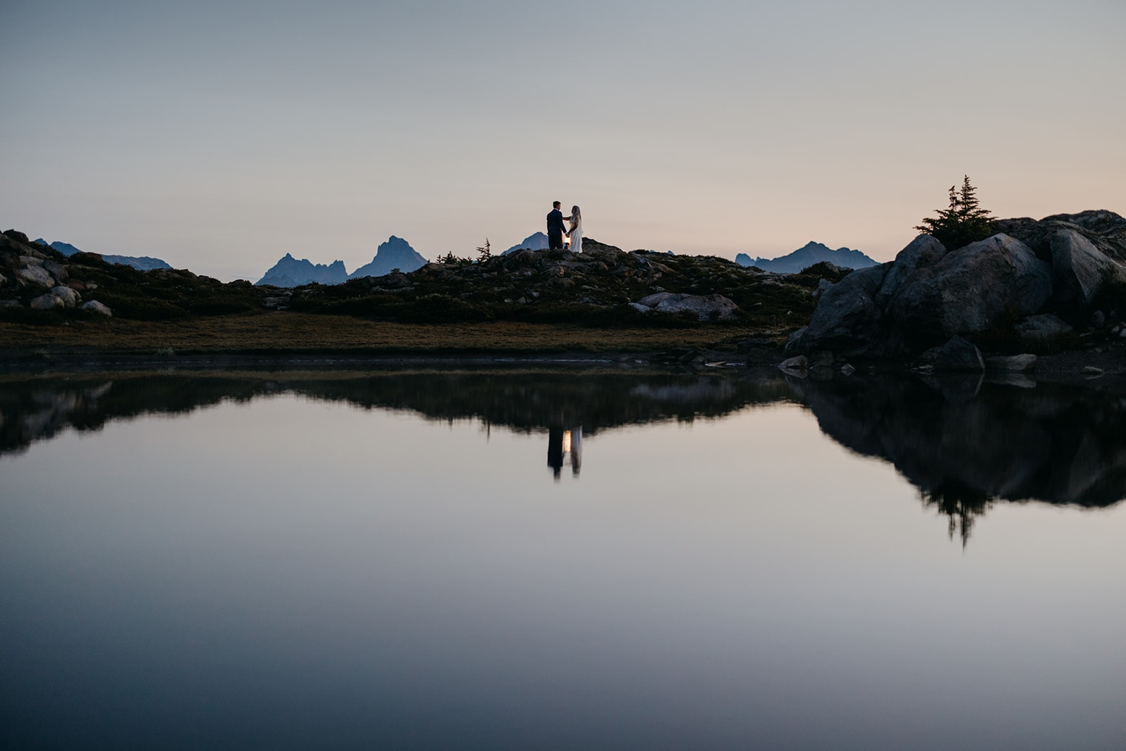 The couple hikes into where they will share vows.