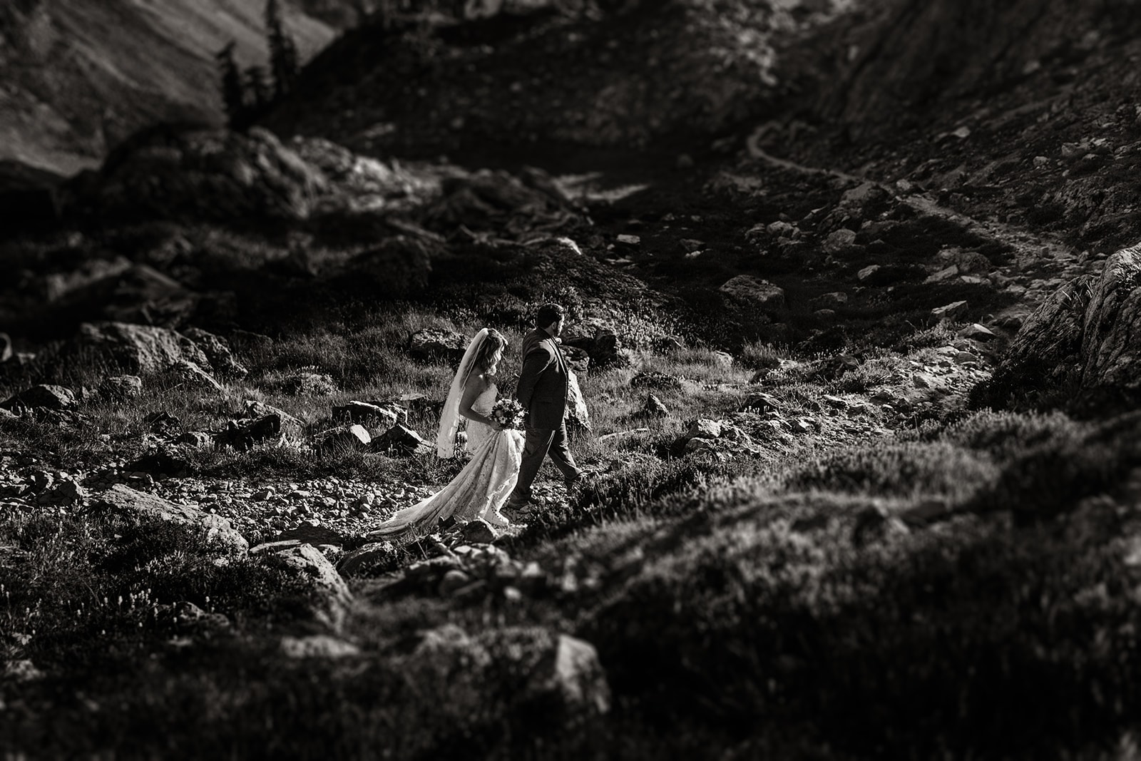The couple walks down the trail together.