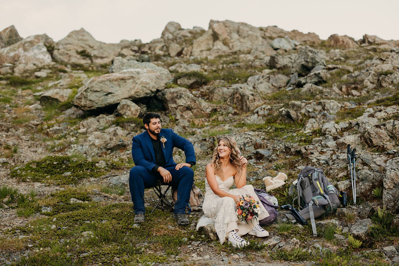 A couple takes a break on the trail during their eloepment.