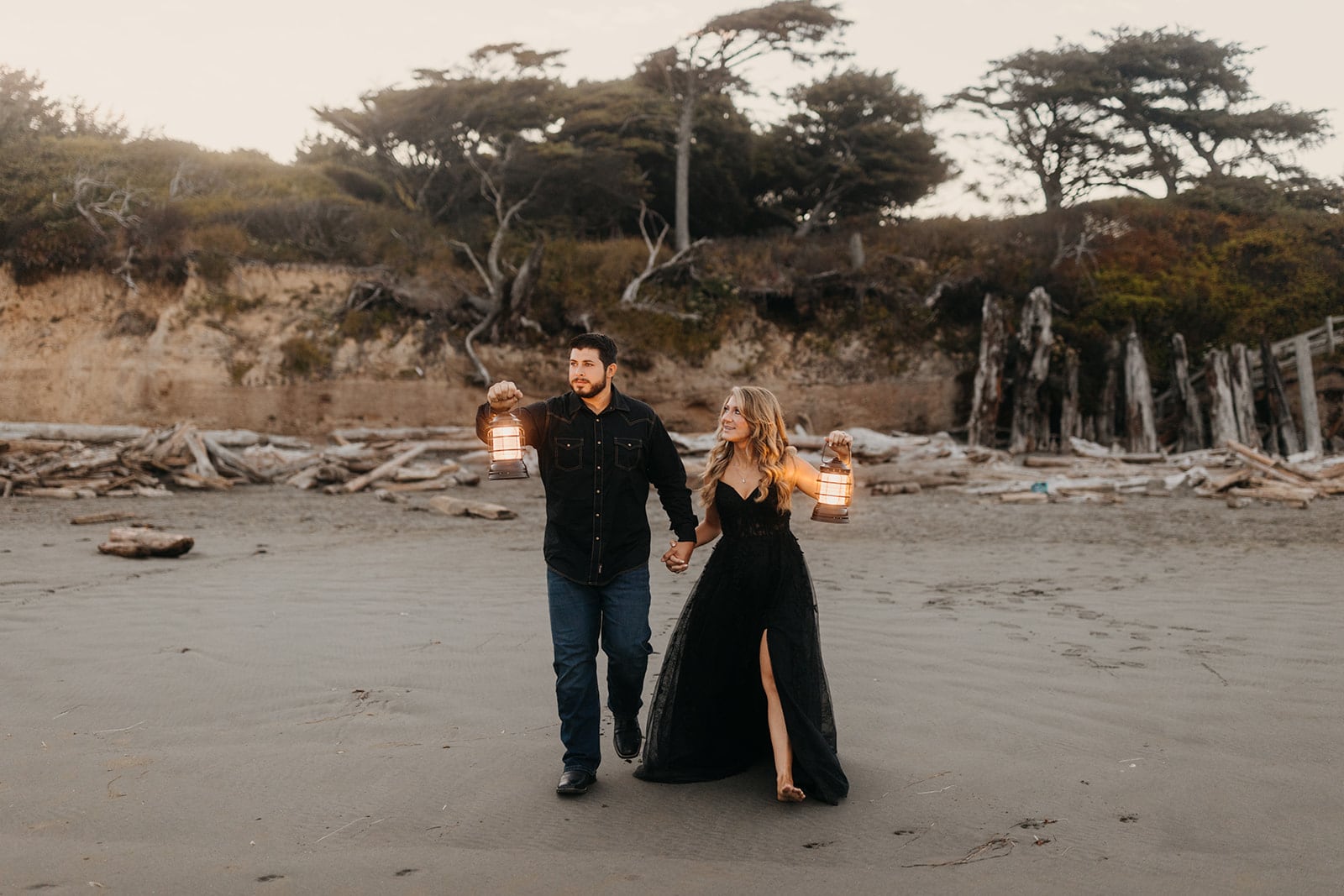 The couple walks on the beach together.