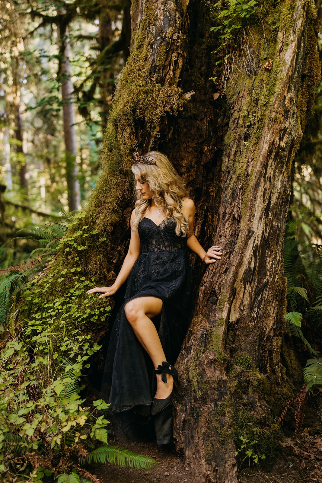 A photo of the bride standing in a tree.