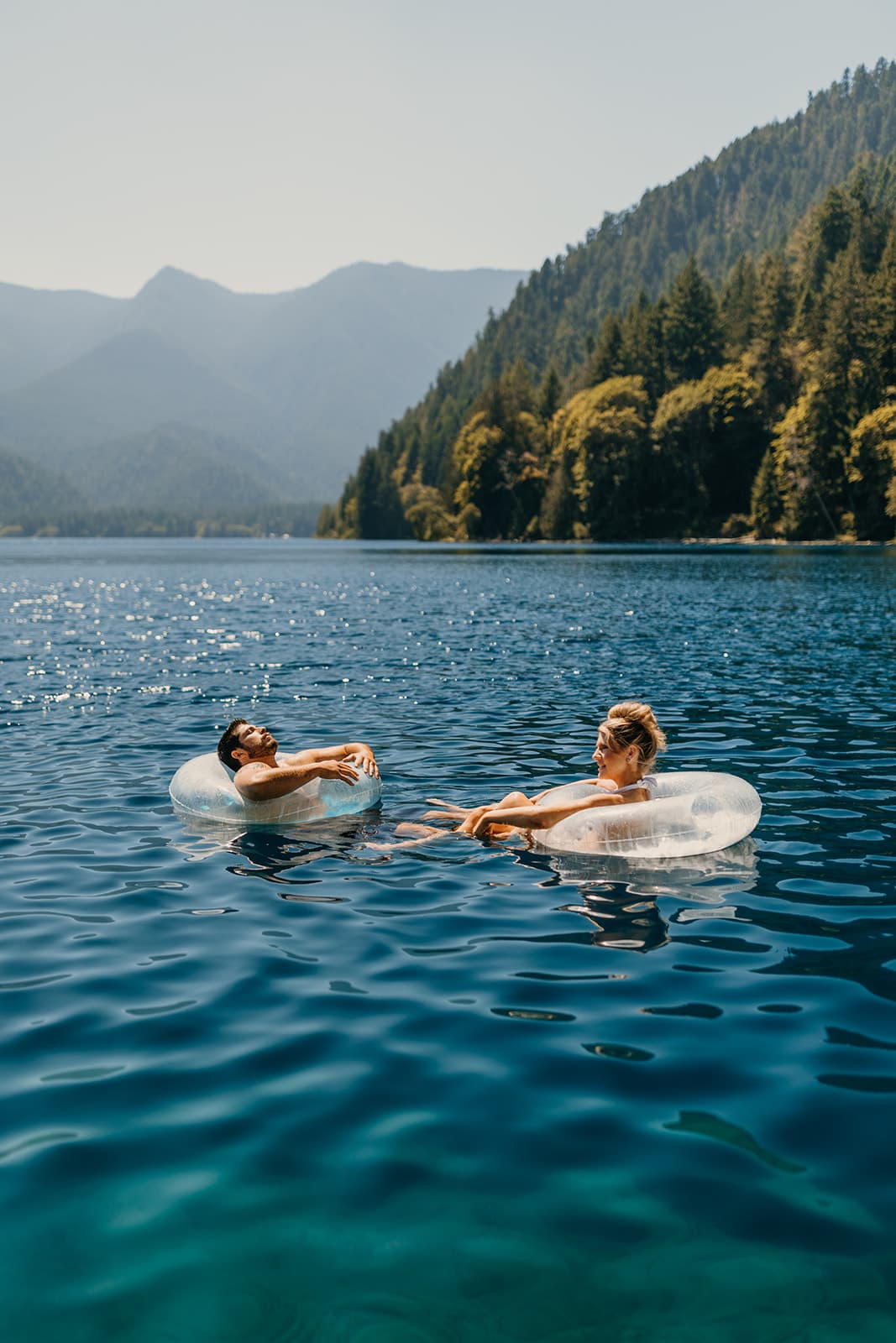 The couple floats together. 