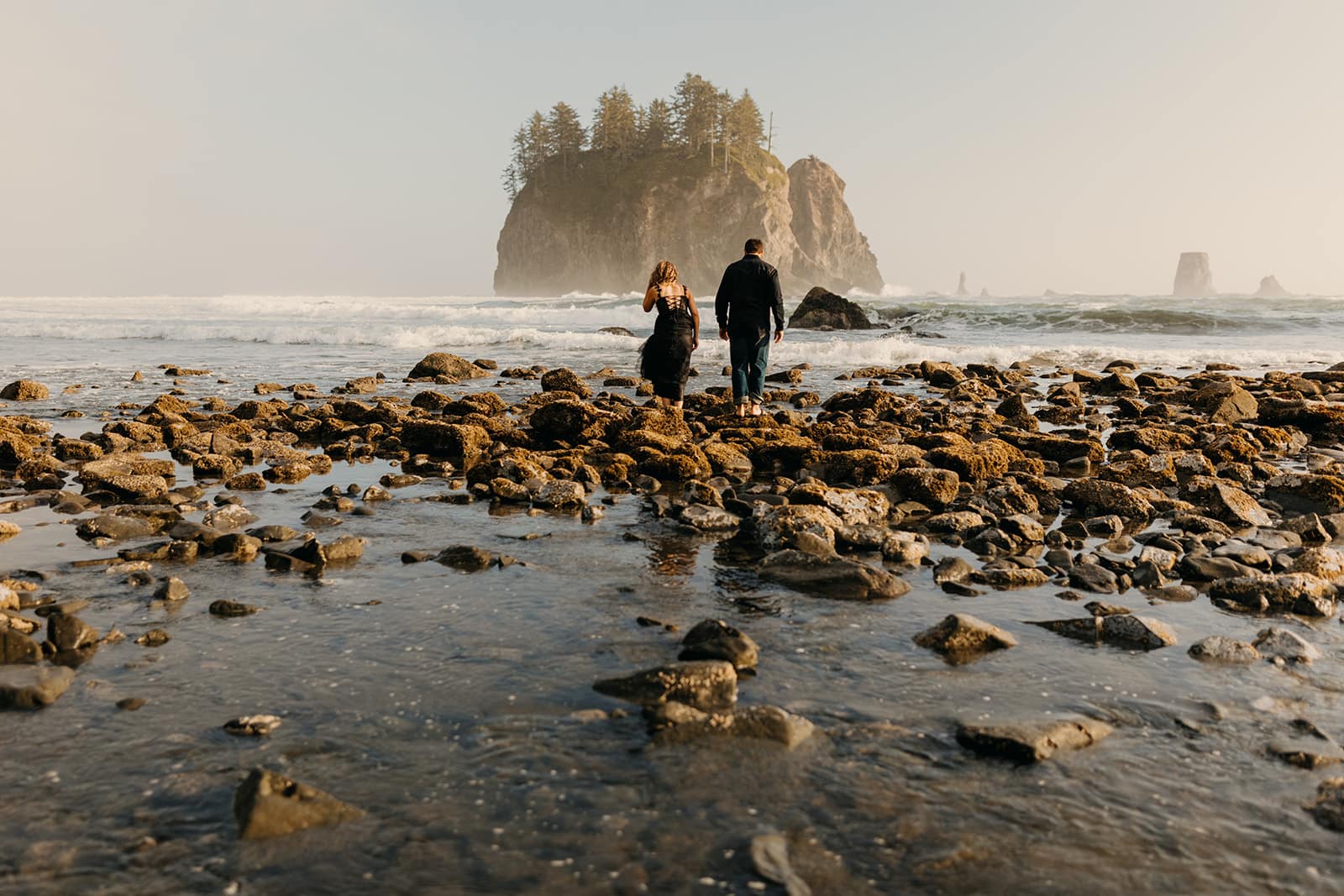A couple explores the tide pools. 