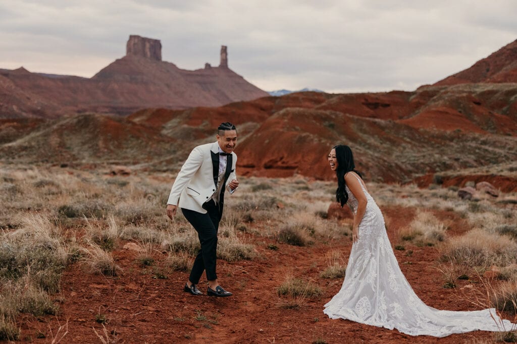 The couple laughs together at their first look.