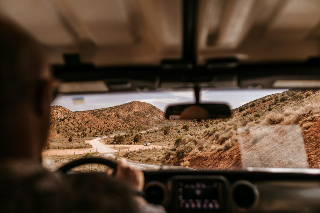 A view of the road ahead from the back seat.