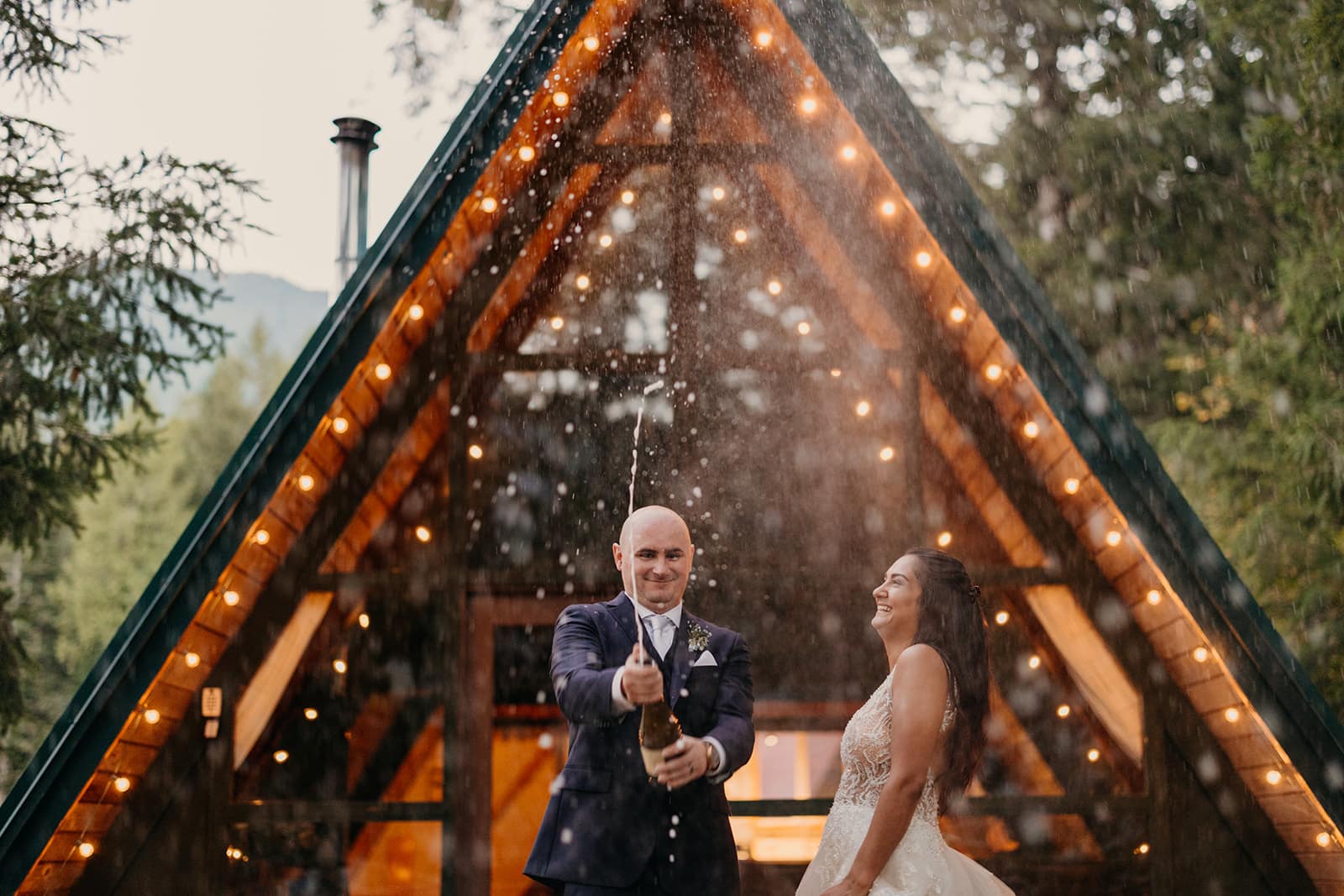 A couple celebrates their wedding day at a beautiful cabin in the woods. 