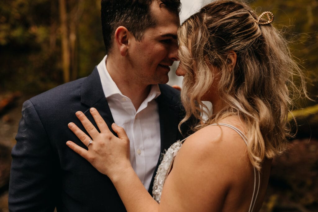 Close up of a newly engaged couple and the ring.