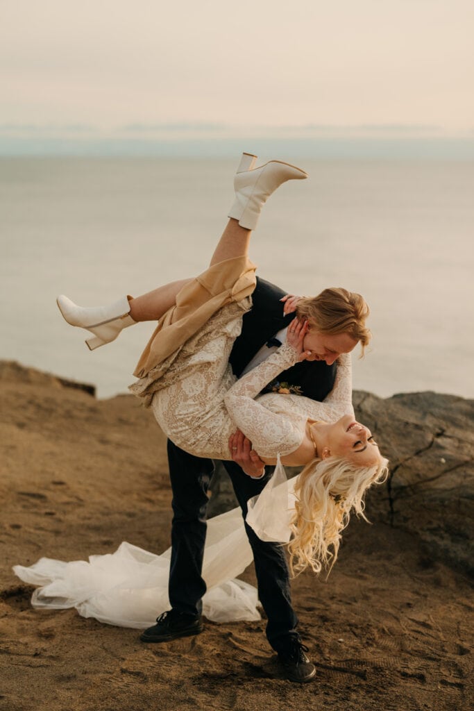A groom dip kisses his bride.