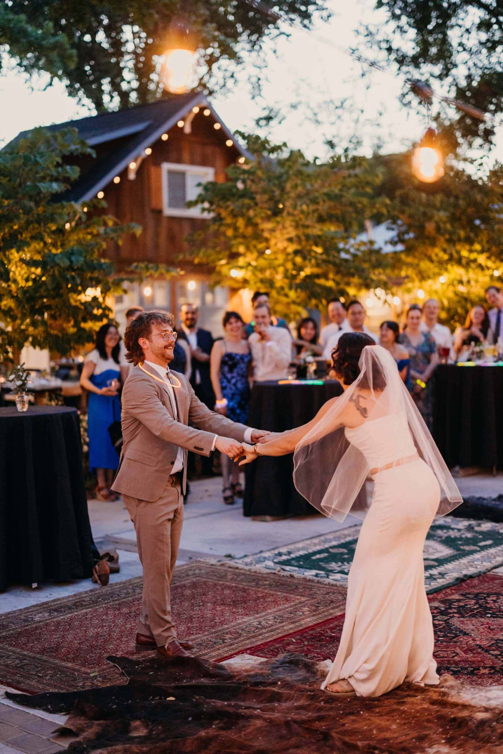 A bride and groom dance at their elopement reception.